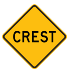 W5-11 Crest ahead warning sign