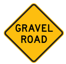 W5-19 Gravel Road Ahead warning sign